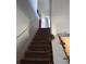 Staircase leading to the upper level of the home at 8278 Silverbell Loop, Brooksville, FL 34613