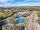 Aerial view of community tennis courts and clubhouse at 9519 Green Needle Dr, New Port Richey, FL 34655