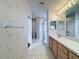 Main bathroom with shower, toilet, double vanity at 9519 Green Needle Dr, New Port Richey, FL 34655