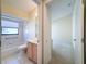 Clean bathroom with tub, toilet and vanity at 9519 Green Needle Dr, New Port Richey, FL 34655