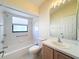 Full bathroom with tub, toilet, vanity at 9519 Green Needle Dr, New Port Richey, FL 34655