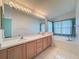 Bathroom features double sinks, a bathtub, and updated cabinets at 9519 Green Needle Dr, New Port Richey, FL 34655