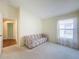Spacious bedroom with a couch and window at 9519 Green Needle Dr, New Port Richey, FL 34655