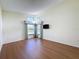 Spacious bedroom with wood-look flooring and large window at 9519 Green Needle Dr, New Port Richey, FL 34655