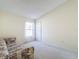 Bright bedroom with a couch and window at 9519 Green Needle Dr, New Port Richey, FL 34655