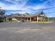 Community clubhouse with welcoming entrance and golf cart at 9519 Green Needle Dr, New Port Richey, FL 34655