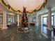 Elegant lobby with a large, decorated Christmas tree at 9519 Green Needle Dr, New Port Richey, FL 34655