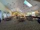 Spacious community room with tables and chairs for events at 9519 Green Needle Dr, New Port Richey, FL 34655