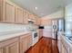 Bright kitchen with light wood cabinets and stainless steel appliances at 9519 Green Needle Dr, New Port Richey, FL 34655