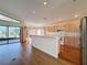 Kitchen with light wood cabinets and stainless steel appliances at 9519 Green Needle Dr, New Port Richey, FL 34655
