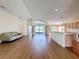 Open living area with kitchen and access to a patio at 9519 Green Needle Dr, New Port Richey, FL 34655