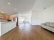 Open concept living space with kitchen and hardwood floors at 9519 Green Needle Dr, New Port Richey, FL 34655