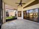 Enclosed porch with ceiling fan and view at 9519 Green Needle Dr, New Port Richey, FL 34655