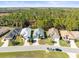 Aerial view of a row of homes in a quiet neighborhood at 10169 Holly Berry Dr, Weeki Wachee, FL 34613