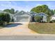 Single-Gathering home with a two-car garage and nicely landscaped lawn at 10169 Holly Berry Dr, Weeki Wachee, FL 34613