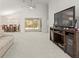 Living room with view of dining area and sliding glass doors to backyard at 10169 Holly Berry Dr, Weeki Wachee, FL 34613