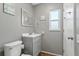 Clean bathroom with gray vanity and tile floor at 10620 Salamanca Dr, Port Richey, FL 34668