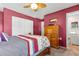Spacious bedroom with wood furniture and ceiling fan at 10620 Salamanca Dr, Port Richey, FL 34668