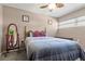 Bedroom with double bed, full-length mirror and ceiling fan at 10620 Salamanca Dr, Port Richey, FL 34668