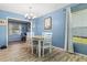 Charming dining room features a table with four chairs and wood-look floors at 10620 Salamanca Dr, Port Richey, FL 34668