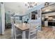 Bright dining room with a table and chairs, and kitchen view at 10620 Salamanca Dr, Port Richey, FL 34668