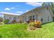 House exterior showcasing landscaping and a walkway at 10620 Salamanca Dr, Port Richey, FL 34668