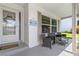 Inviting front porch with seating area, perfect for relaxing at 10620 Salamanca Dr, Port Richey, FL 34668