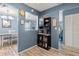 Kitchen entry with built-in shelving and wood-look floors at 10620 Salamanca Dr, Port Richey, FL 34668