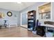 Home office with exercise bike, shelving, and desk at 10620 Salamanca Dr, Port Richey, FL 34668