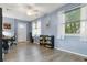 Home office with built-in shelving and hardwood floors at 10620 Salamanca Dr, Port Richey, FL 34668