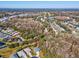 Single-story home nestled among trees, with a view of the neighborhood at 11509 Sinatra Ct, New Port Richey, FL 34654