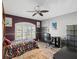 Cozy bedroom with wood floors, a desk, and built-in shelving at 11509 Sinatra Ct, New Port Richey, FL 34654