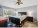 Main bedroom with wood floors and ceiling fan at 11509 Sinatra Ct, New Port Richey, FL 34654