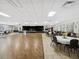 Spacious community room with tables and chairs for events at 11509 Sinatra Ct, New Port Richey, FL 34654