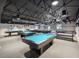 Community game room featuring billiard tables and comfortable seating at 11509 Sinatra Ct, New Port Richey, FL 34654