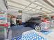 Spacious two-car garage with overhead storage and room for vehicles at 11509 Sinatra Ct, New Port Richey, FL 34654