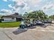 Several parked golf carts in front of the Summertree Golf Club at 11509 Sinatra Ct, New Port Richey, FL 34654