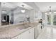 Kitchen features granite counters, white cabinets, and a double sink at 11509 Sinatra Ct, New Port Richey, FL 34654