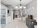 Open kitchen with granite countertops, white cabinets and a coffee bar at 11509 Sinatra Ct, New Port Richey, FL 34654