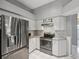 Modern kitchen with stainless steel appliances and granite countertops at 11509 Sinatra Ct, New Port Richey, FL 34654