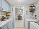 Laundry Room with washer, dryer, and access to kitchen at 11509 Sinatra Ct, New Port Richey, FL 34654