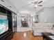Open concept living and dining area with hardwood floors at 11509 Sinatra Ct, New Port Richey, FL 34654