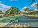 Several shuffleboard courts with green playing surfaces and covered seating at 11509 Sinatra Ct, New Port Richey, FL 34654