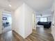 Hallway with wood-like floors and views into other rooms at 12085 Petrel Ave, Brooksville, FL 34614