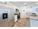 Modern kitchen with stainless steel appliances and granite countertops at 12085 Petrel Ave, Brooksville, FL 34614