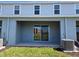 Covered patio with sliding glass doors and AC unit at 12466 Amber Creek Cir, Lakewood Ranch, FL 34211