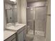 Bathroom with double vanity, quartz countertop, and large shower at 12466 Amber Creek Cir, Lakewood Ranch, FL 34211