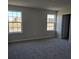 Bright bedroom with carpet flooring and two large windows at 12466 Amber Creek Cir, Lakewood Ranch, FL 34211