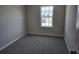 Bright bedroom with carpeted floor and large window at 12466 Amber Creek Cir, Lakewood Ranch, FL 34211