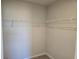 Walk-in closet with wire shelving at 12466 Amber Creek Cir, Lakewood Ranch, FL 34211